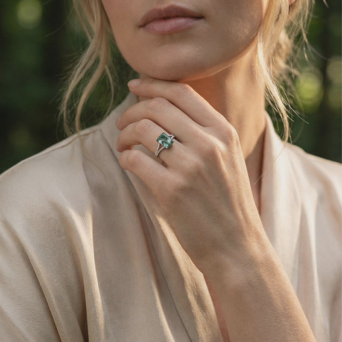 A solid gold ring with a natural moss agate gemstone and moissanite accents.