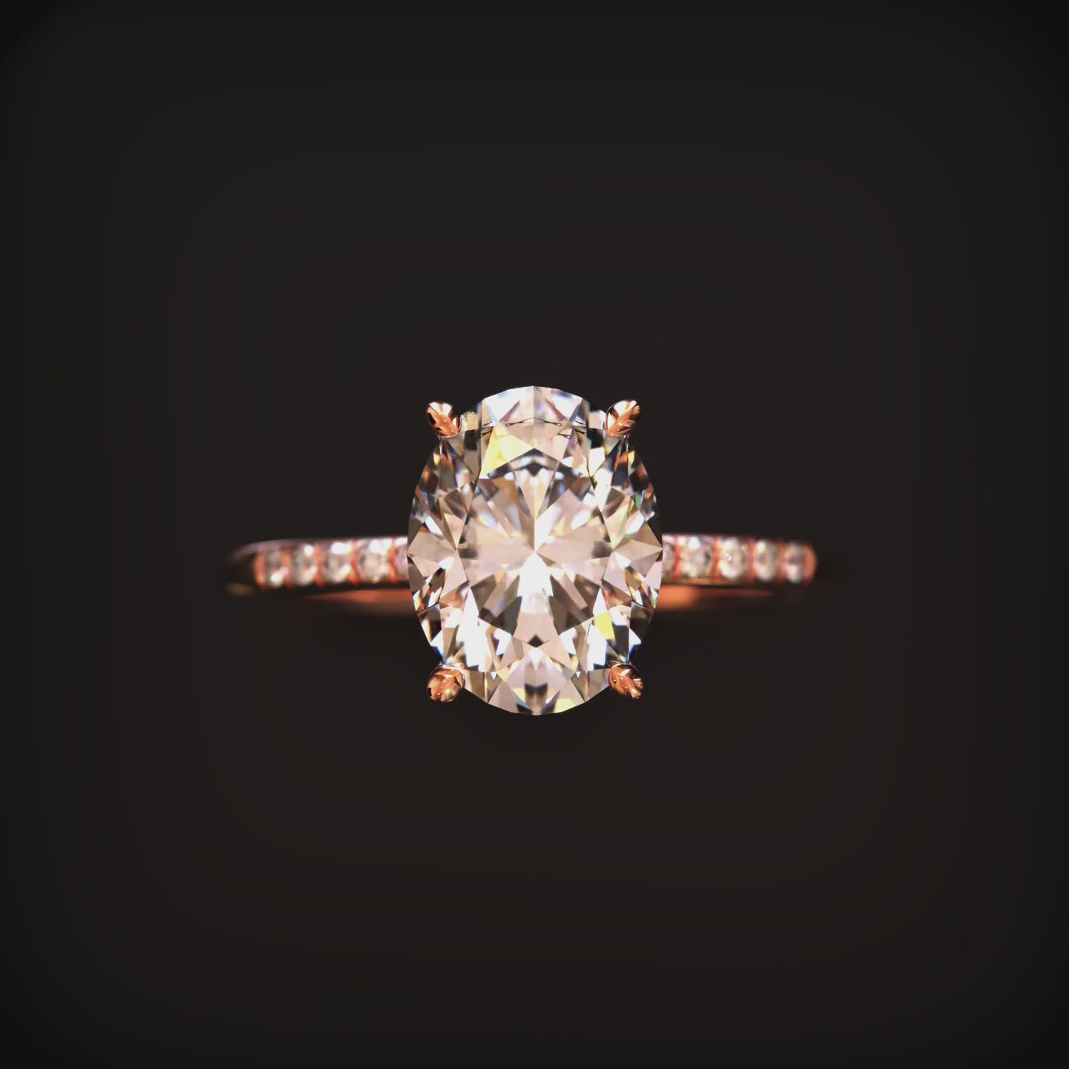 Video of an oval moissanite ring in solid gold.