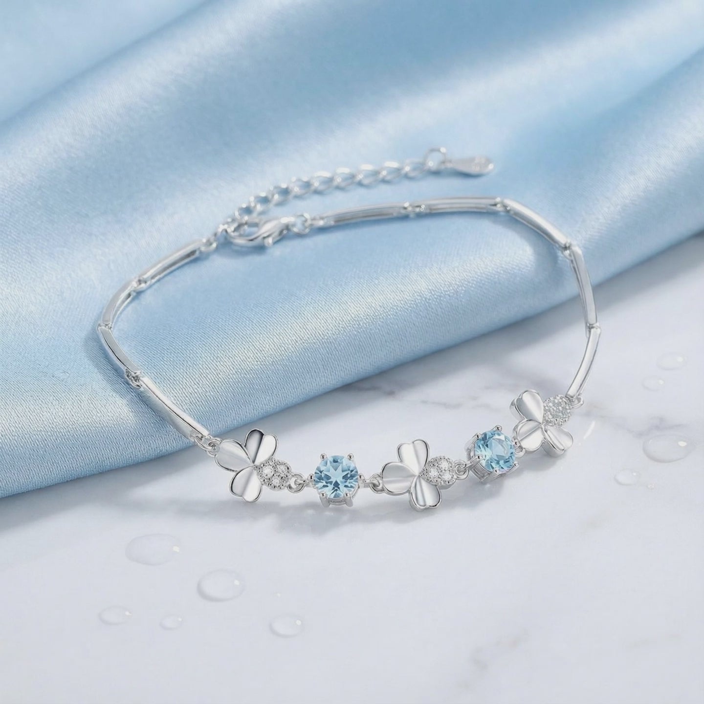 Solid gold bracelet with simulated aquamarine stones.