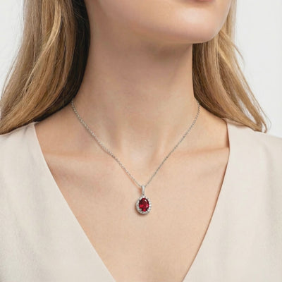 Simulated ruby halo necklace in solid gold.
