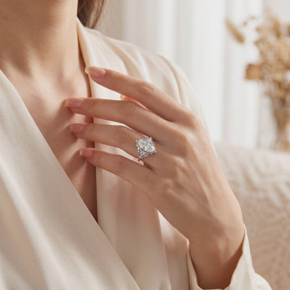 On-hand view of the silver Thara Ring featuring a large marquise-cut center stone.