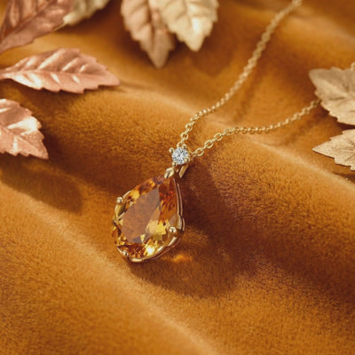 Video of The Aurelienne pear-cut simulated topaz solid gold necklace.