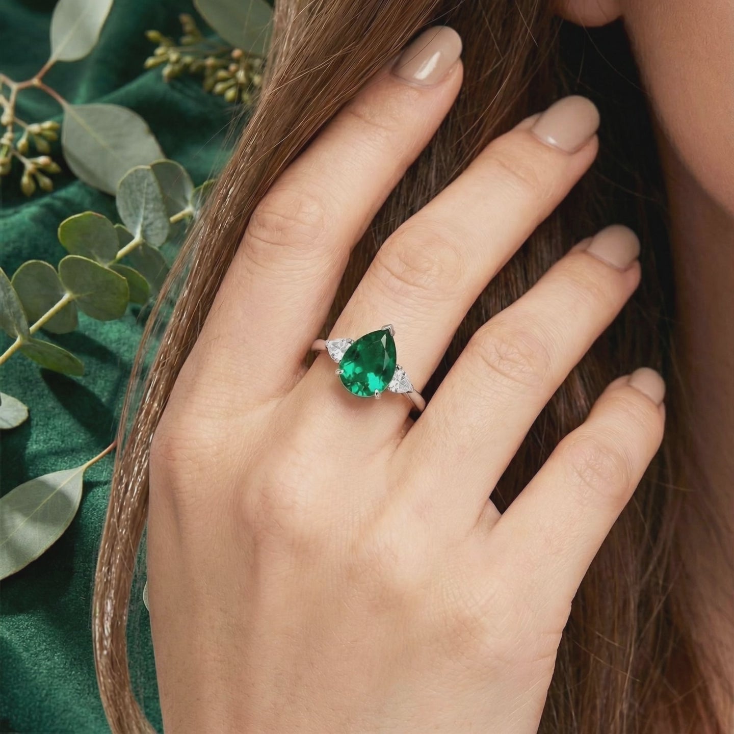 Simulated emerald ring in solid white gold.