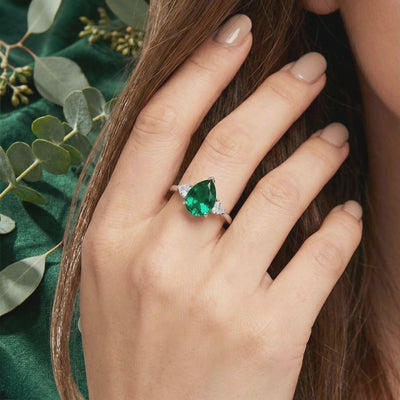 Simulated emerald ring in solid white gold.