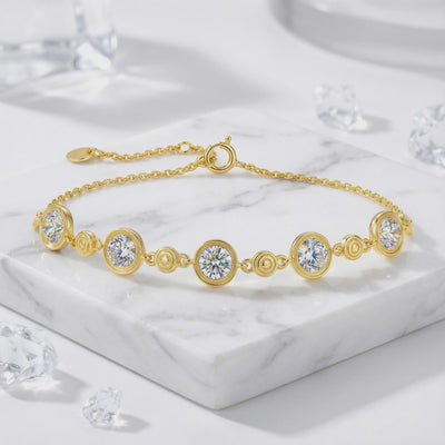 Mirellia station bracelet in solid gold with simulated diamonds.