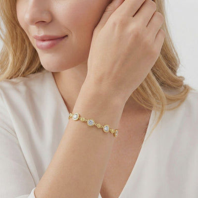 Mirellia station bracelet in solid gold with simulated diamonds.