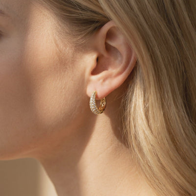 Moissanite J-hoop earrings in solid gold.