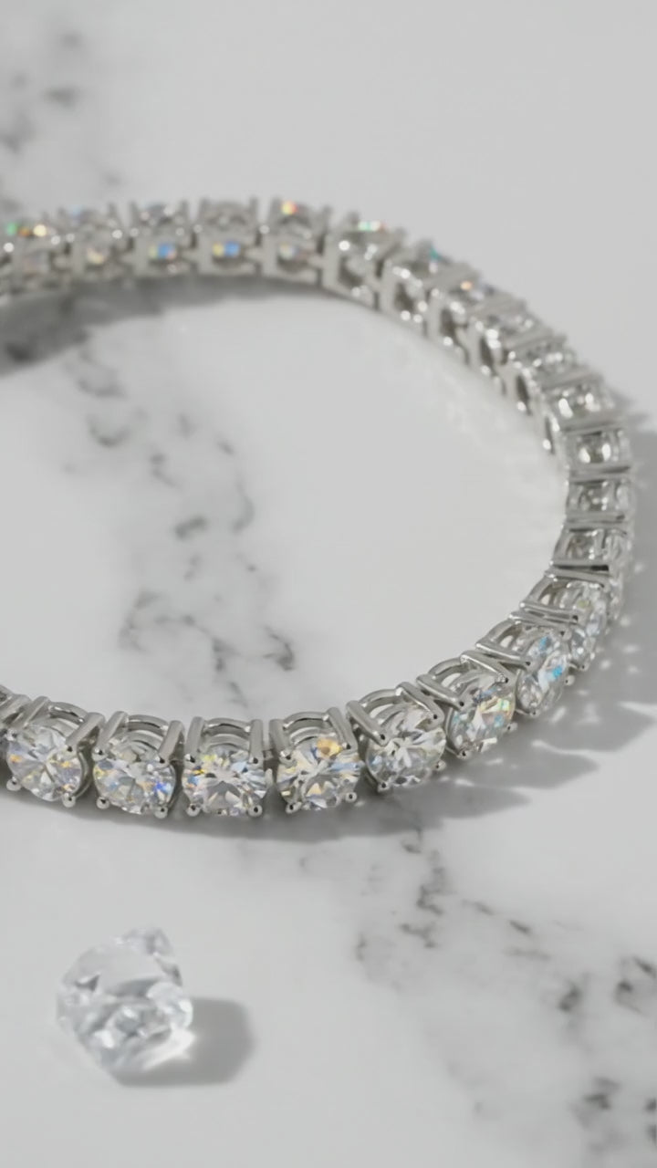A solid gold moissanite tennis bracelet.