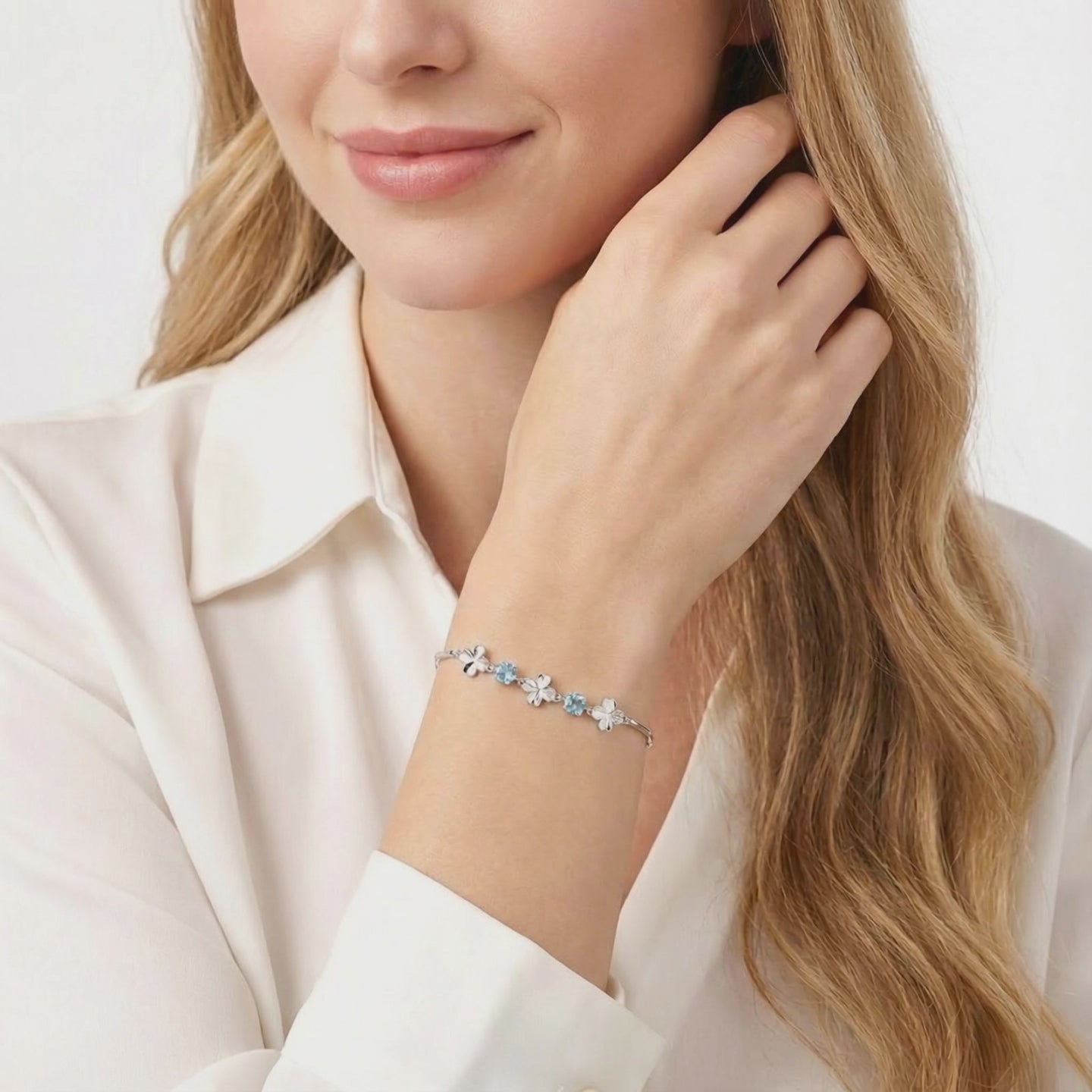 Solid gold bracelet with simulated aquamarine stones.