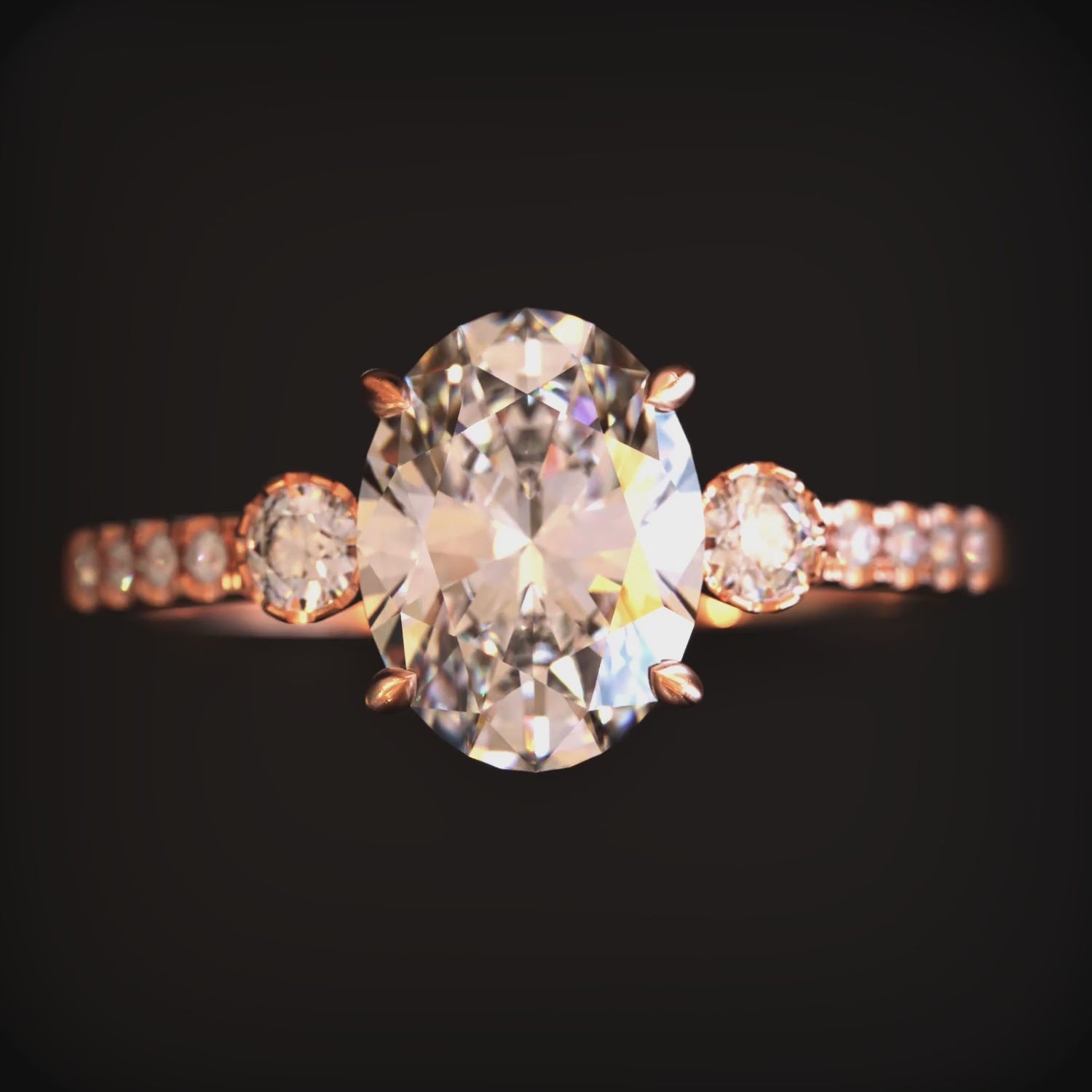 A ring with a 2 carat oval moissanite and solid gold material
