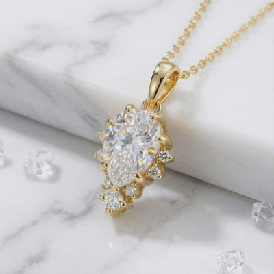 Solid gold necklace with pear-cut A5 Zirconia pendant.