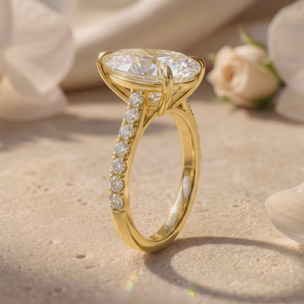 The Opaline ring shown in angled side profile, with a raised pear-cut center stone, prongs, gallery details, and pavé band.