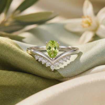 Video of a solid gold ring with a pear cut peridot.