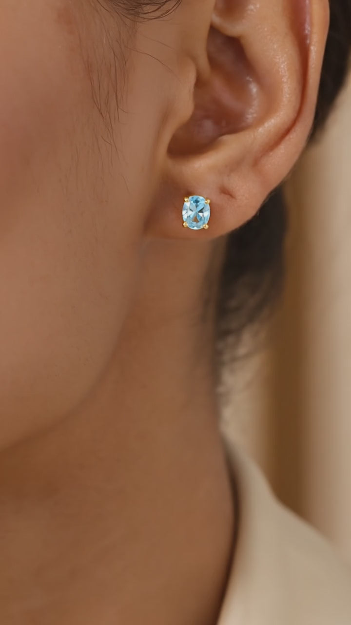 Oval Simulated Aquamarine Solid Gold Stud Earrings.