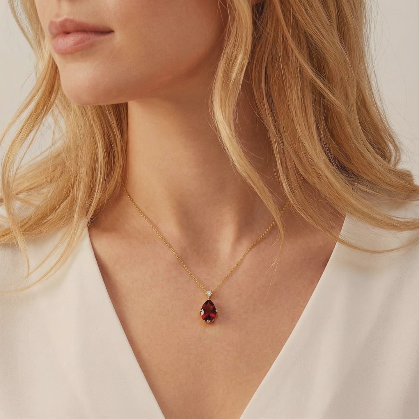Simulated garnet solid gold necklace.