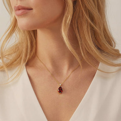 Simulated garnet solid gold necklace.