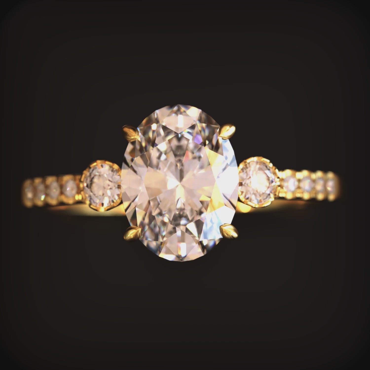 A ring with a 2 carat oval moissanite and solid gold material