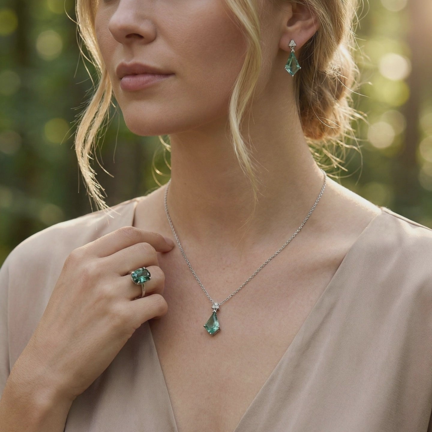 A solid gold jewelry set with green moissanite and moss agate.
