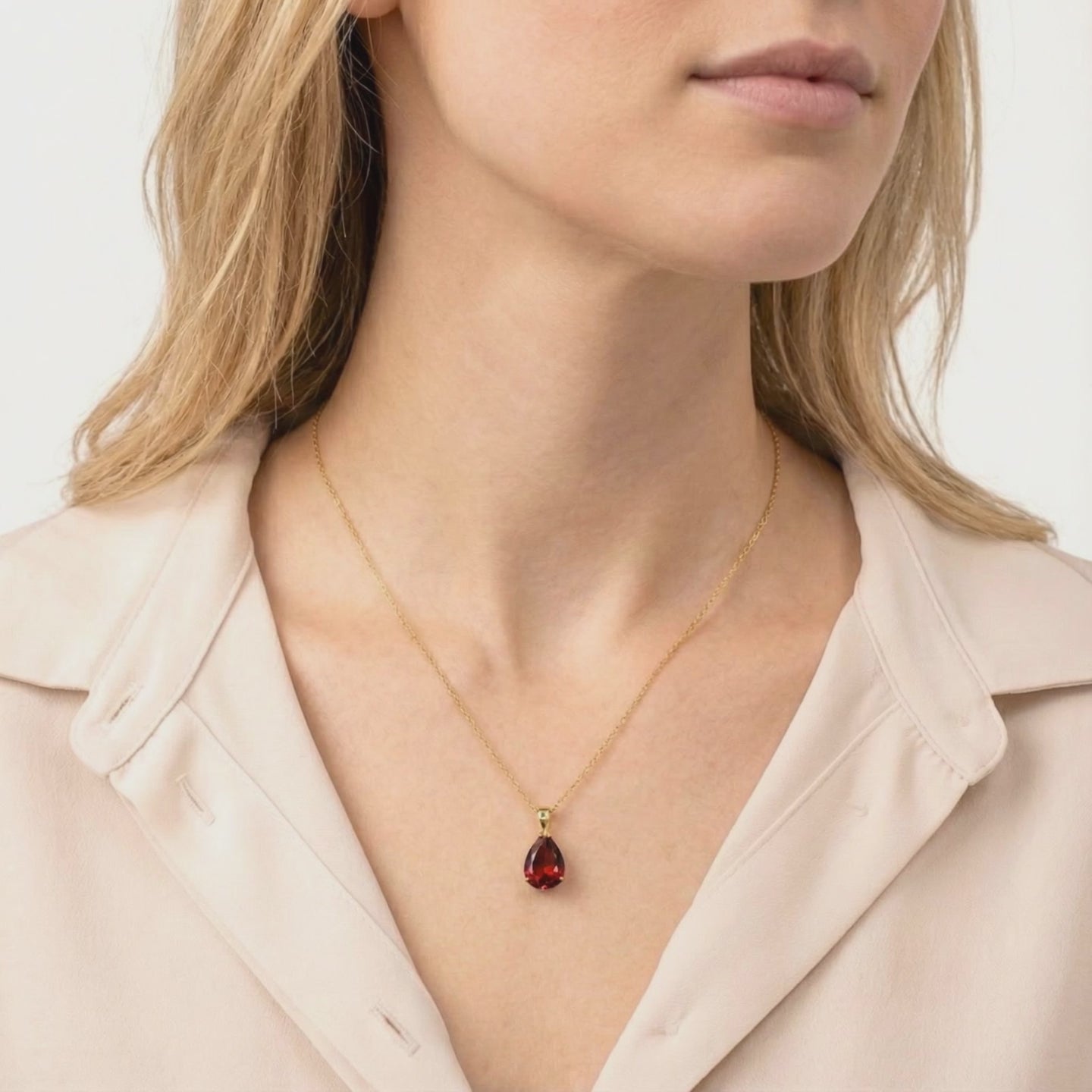 Simulated garnet pendant necklace in solid gold.