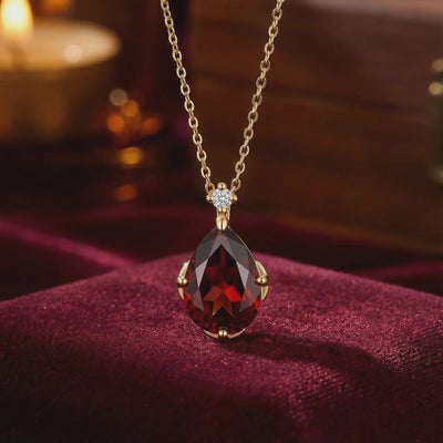 Simulated garnet solid gold necklace.