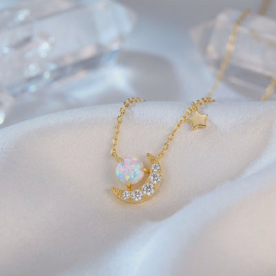 Solid gold necklace with natural opal pendant.