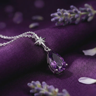 A necklace with a pear-cut amethyst pendant in solid gold.
