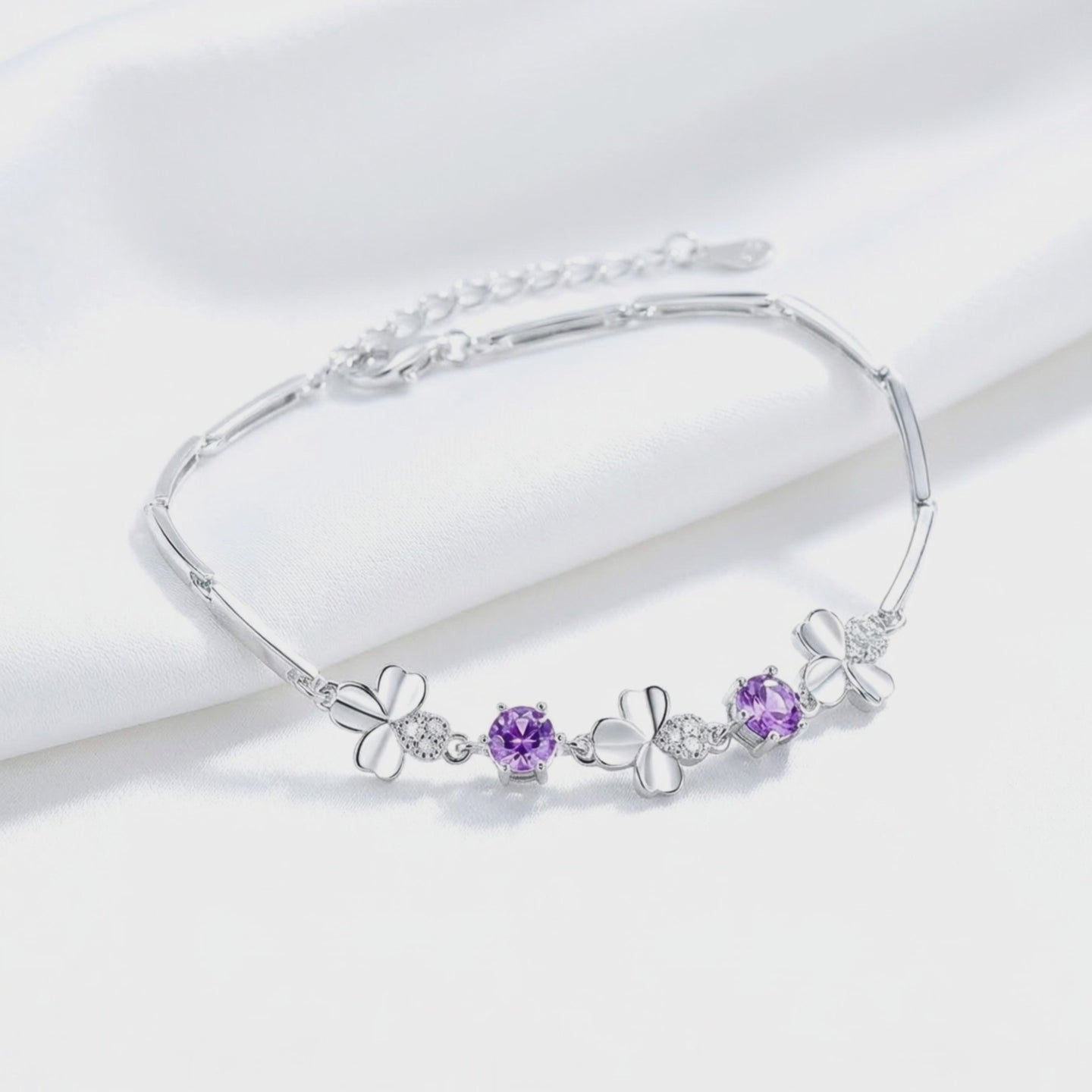 Solid gold bracelet with simulated amethyst stones.