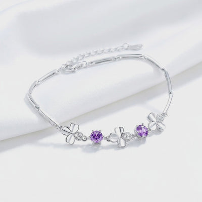 Solid gold bracelet with simulated amethyst stones.