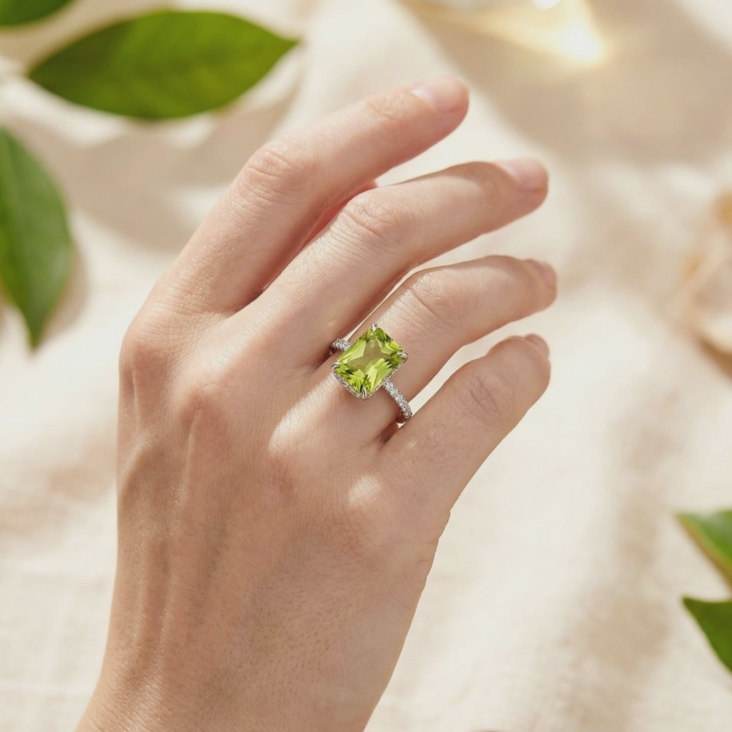 Radiant simulated peridot ring in solid gold.