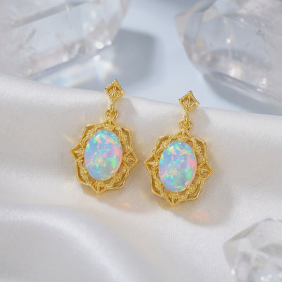 Odessia drop earrings with white opals in solid gold.