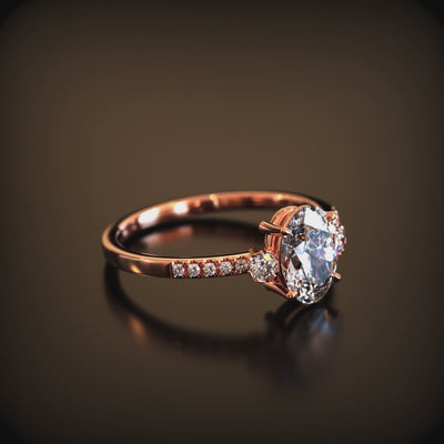 A ring with a 2 carat oval moissanite and solid gold material