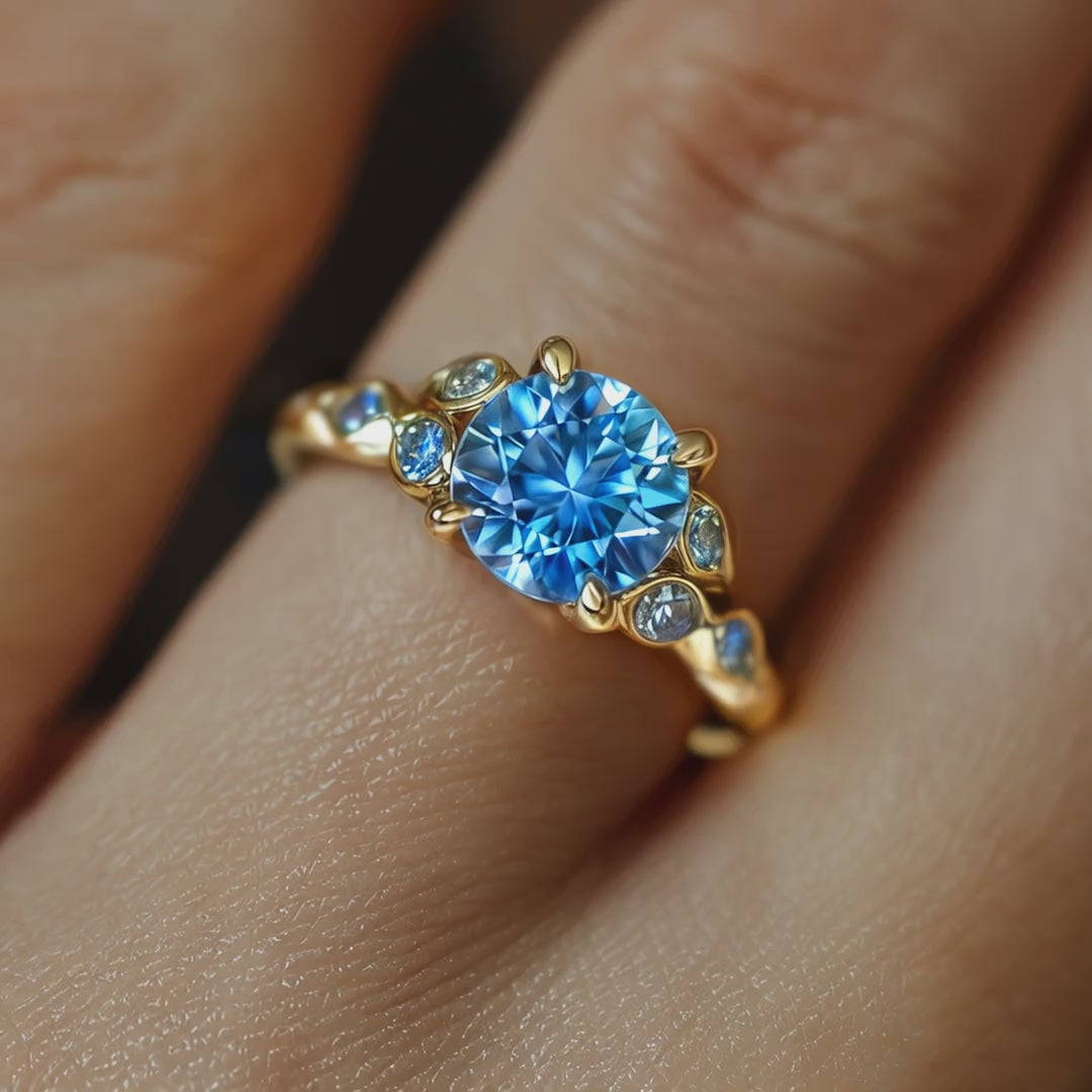 The Katalina solid gold ring with a blue moissanite.