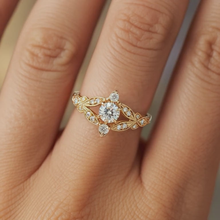 A solid gold ring, The Isadora, with a 1 carat round moissanite.
