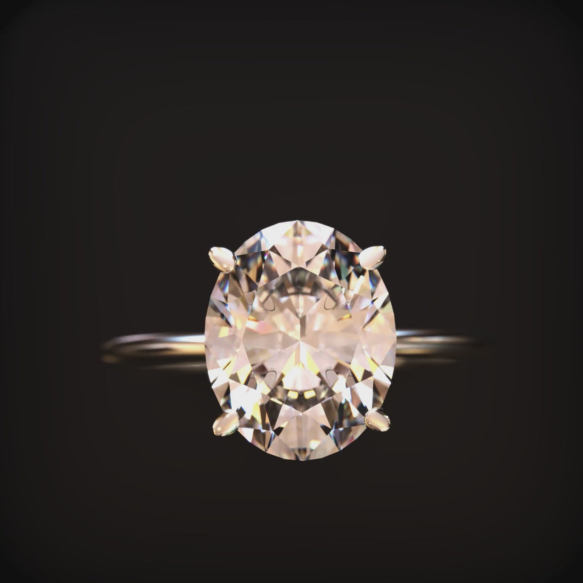 The Bella oval moissanite solitaire ring in 14K solid gold.