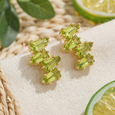 Zephyraea Vine earrings in solid gold with simulated peridot.