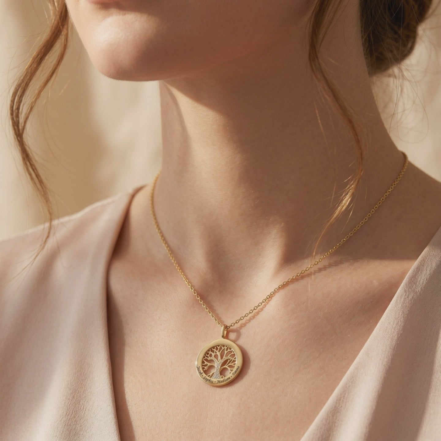 Solid gold necklace with Tree of Life pendant.