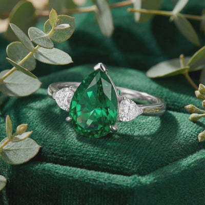 Simulated emerald ring in solid white gold.