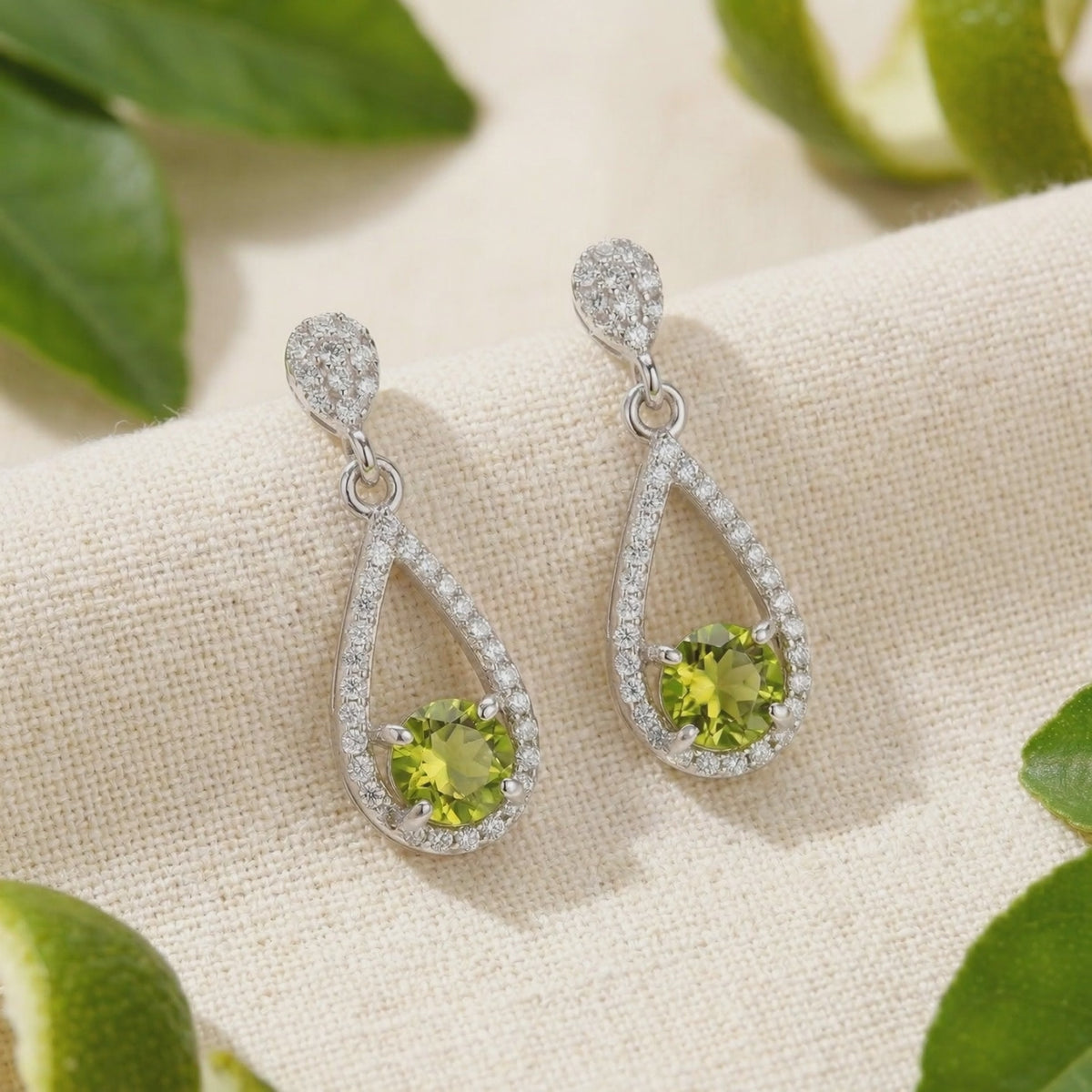 Valerelle Drop earrings with simulated peridot in solid gold.