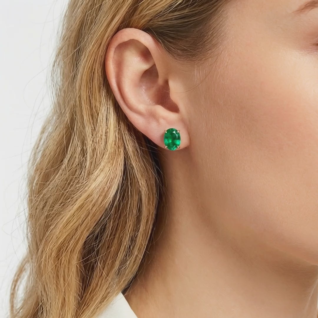 Elianore oval simulated emerald stud earrings in solid gold.