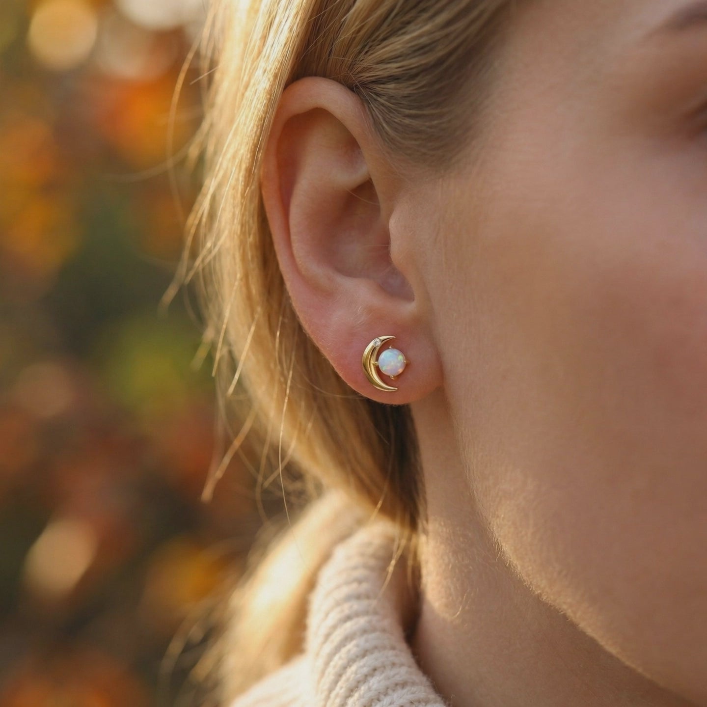 Orianna opal crescent moon stud earrings in solid gold.