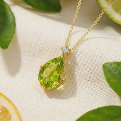 Solid gold necklace with simulated peridot pendant.