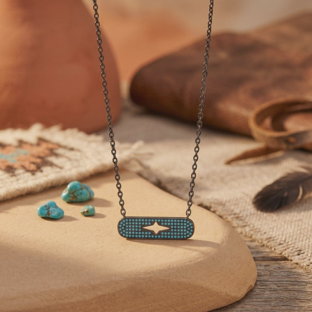 Turquoise-studded silver bar necklace with a central star-shaped cutout, displayed on a tan surface.
