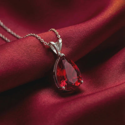 Pear cut red moissanite solid gold necklace.