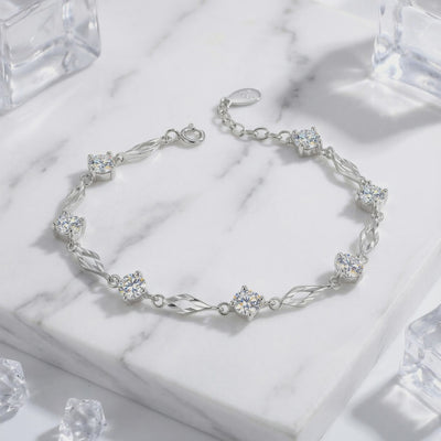 A solid gold station bracelet with simulated diamonds.