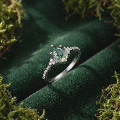 Oval natural moss agate solitaire ring crafted in 14K or 18K solid white gold.