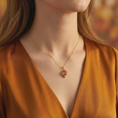 Video of The Calyssie pear-cut Simulated Topaz solid gold necklace.