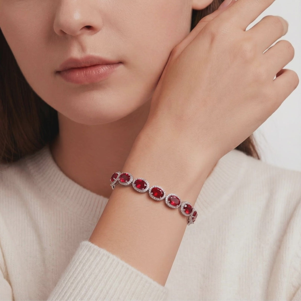 Solid gold tennis bracelet with simulated rubies.