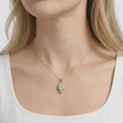 Solid gold necklace with pear-cut A5 Zirconia pendant.