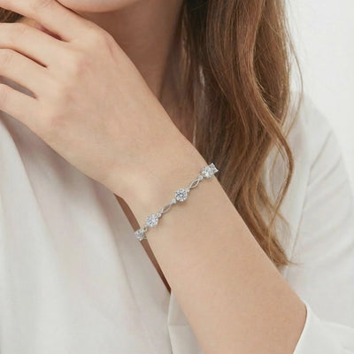A solid gold station bracelet with simulated diamonds.