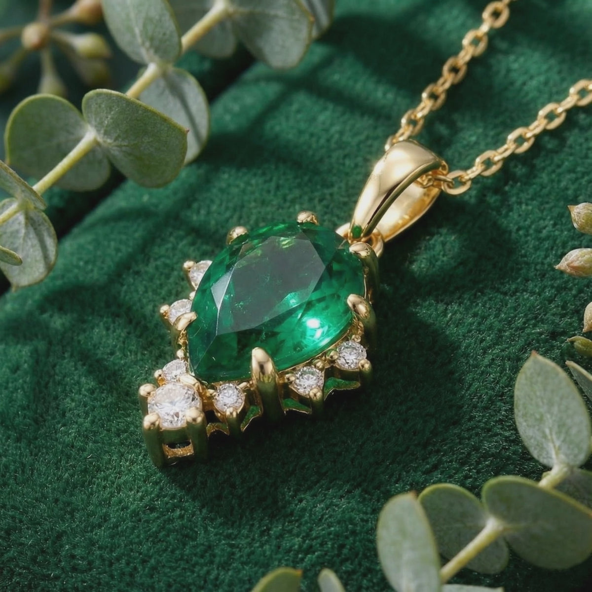 Pear-cut simulated emerald necklace in solid gold.